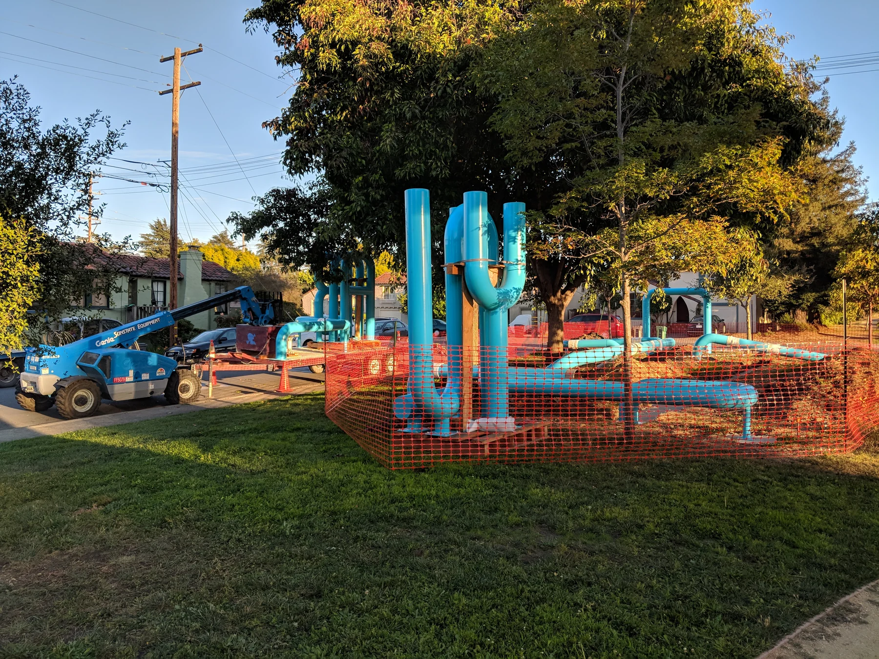 Albany Loop lettering and sculptural pipe forms during on-site installation