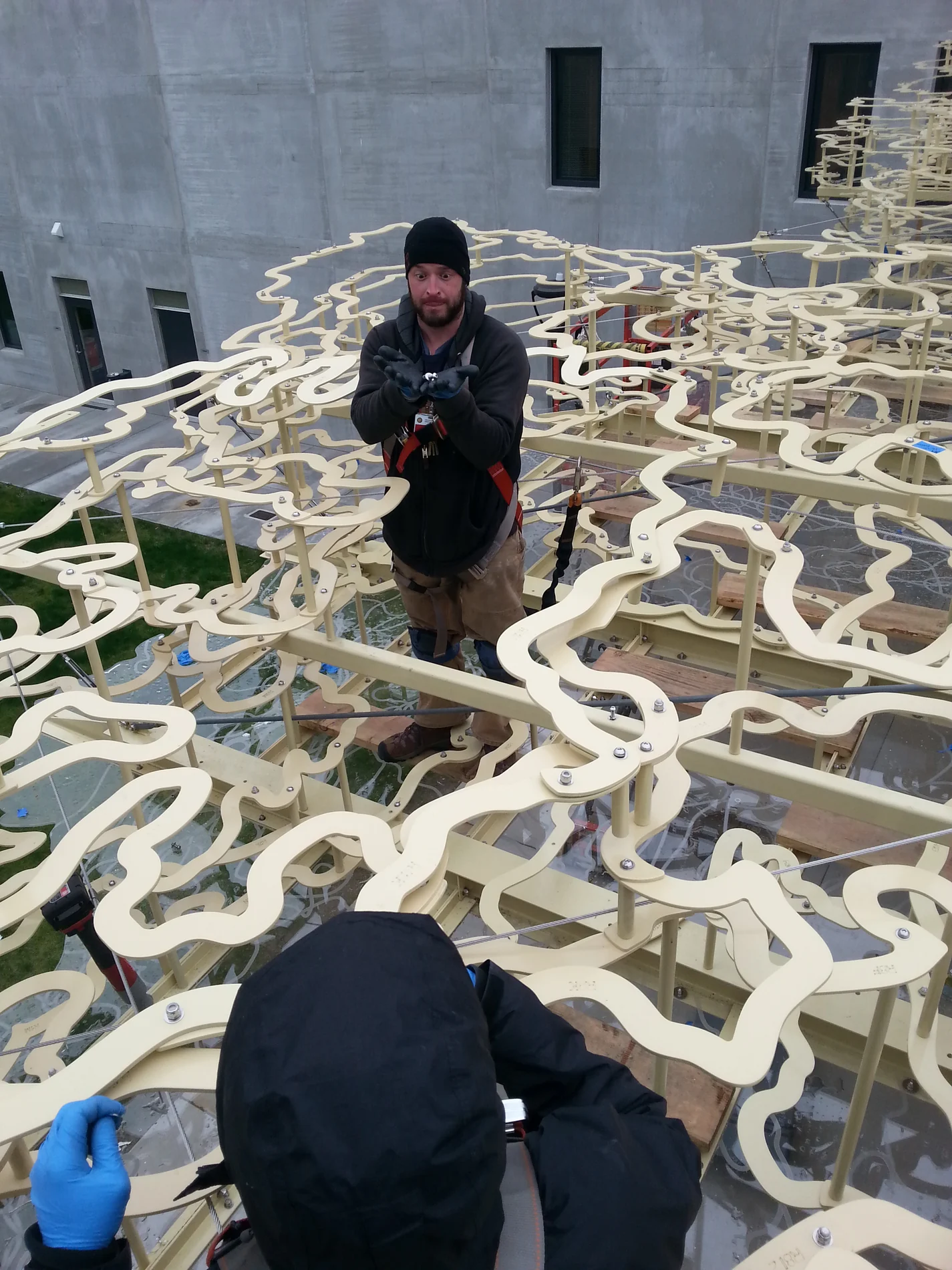 Crew working on the Passing Storms cloud assembly during installation
